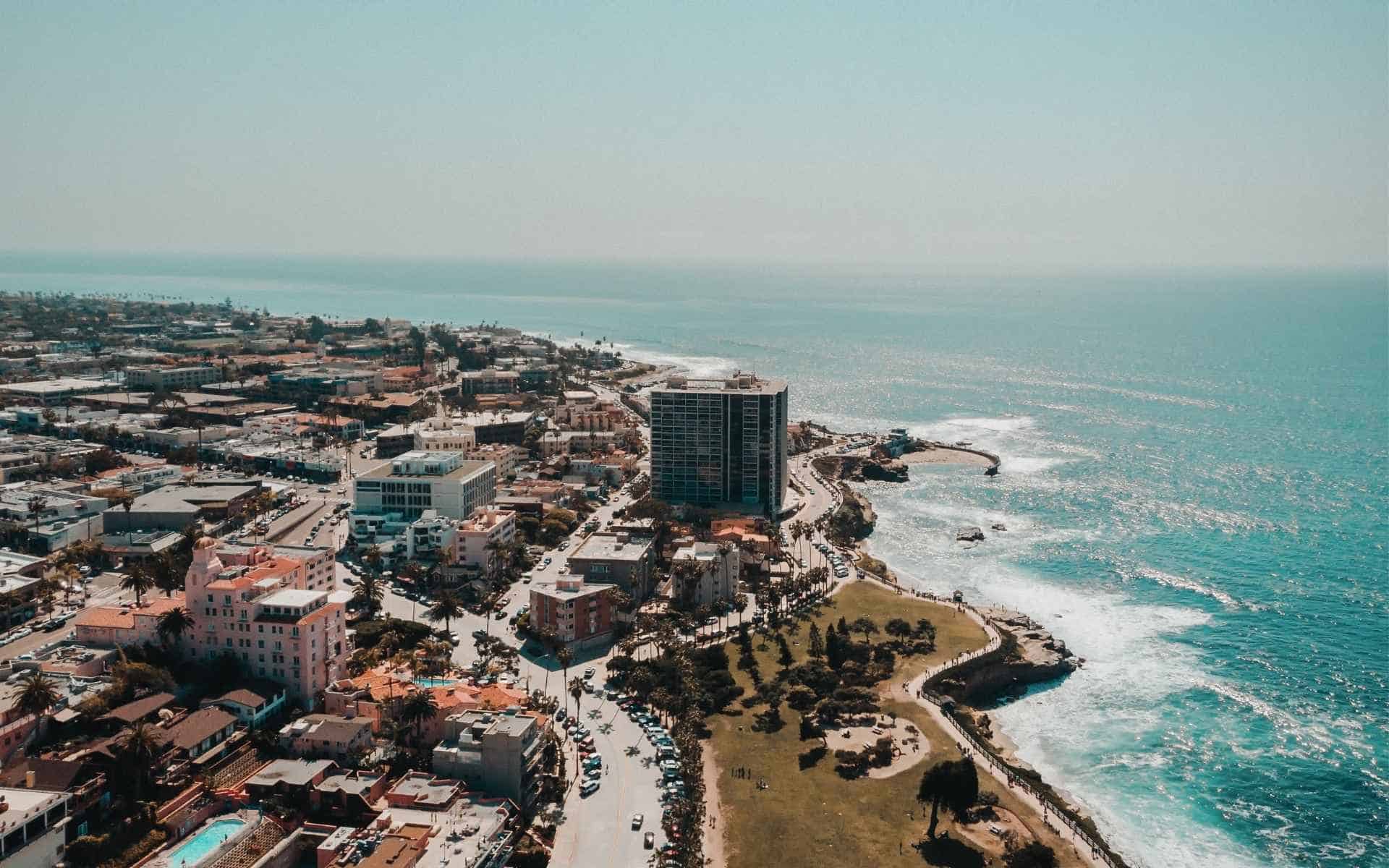 San Diego beaches offer family-friendly coves, world‑class surf, lively boardwalks, and quiet stretches of sand where we can hear the waves.