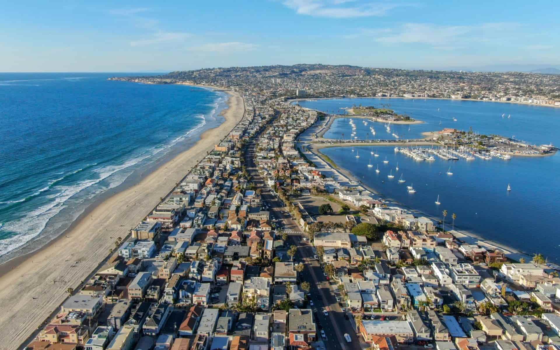 Aerial view of San Diego coastal neighborhoods with beach homes for vacation rental owners