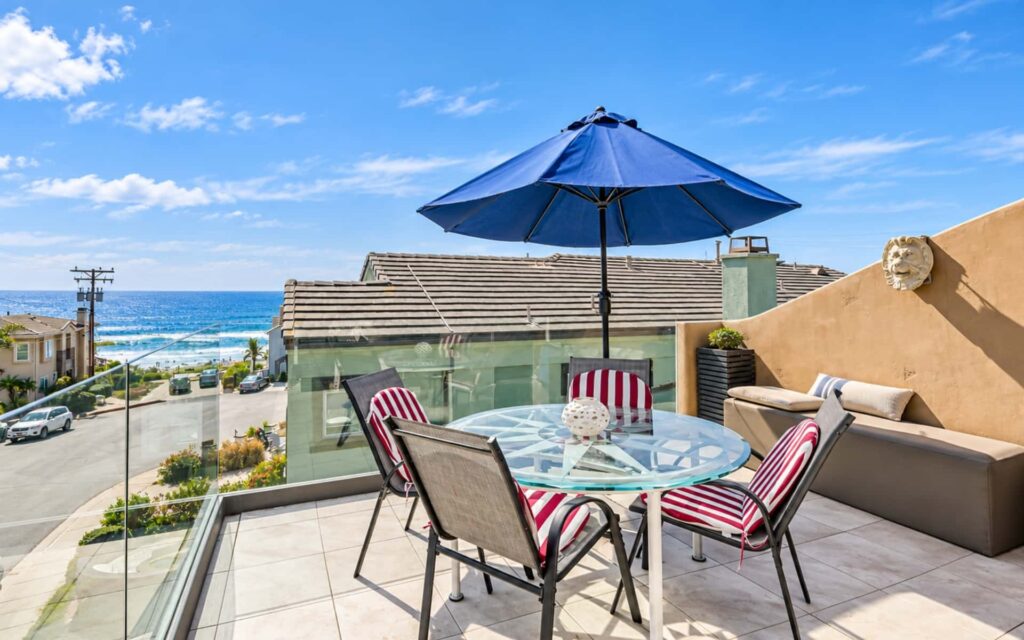 Carlsbad Vacation Rental Outdoor Amenity Maintenance Ocean-view outdoor patio and seating area at a Carlsbad vacation rental