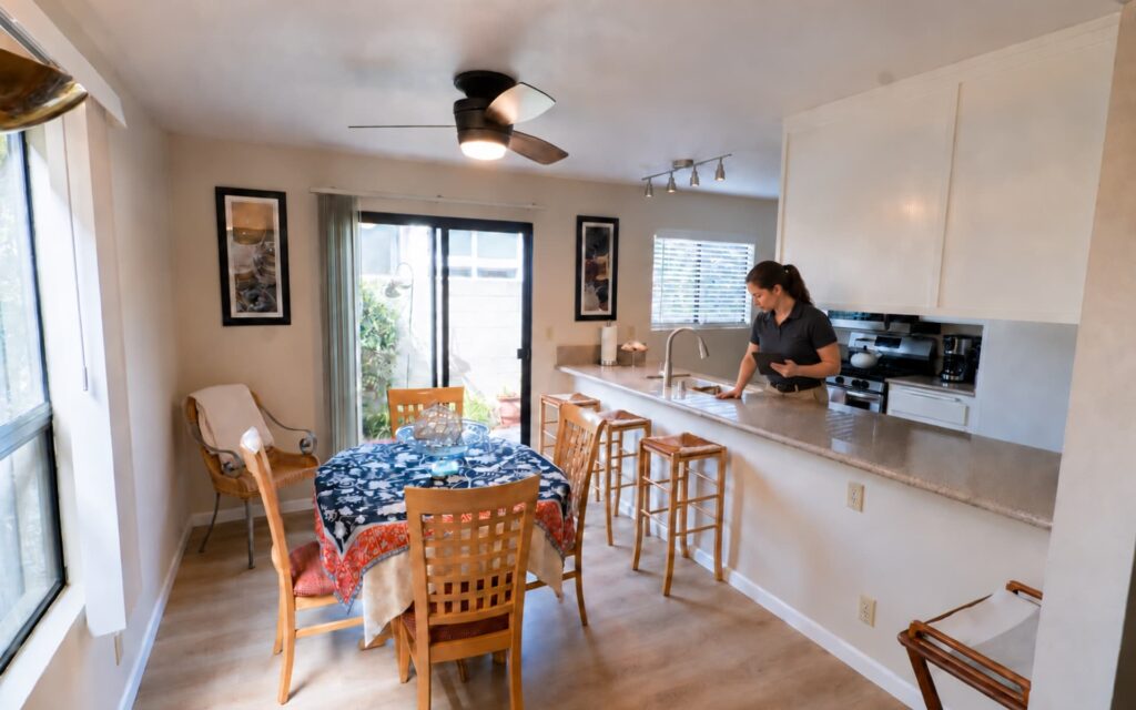Carlsbad Vacation Rental Property Inspection Property inspector checking the kitchen of a Carlsbad vacation rental