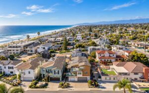 Aerial view of a Southern California coastal neighborhood near the beach, showing the type of location that can appeal to vacation rental guests.