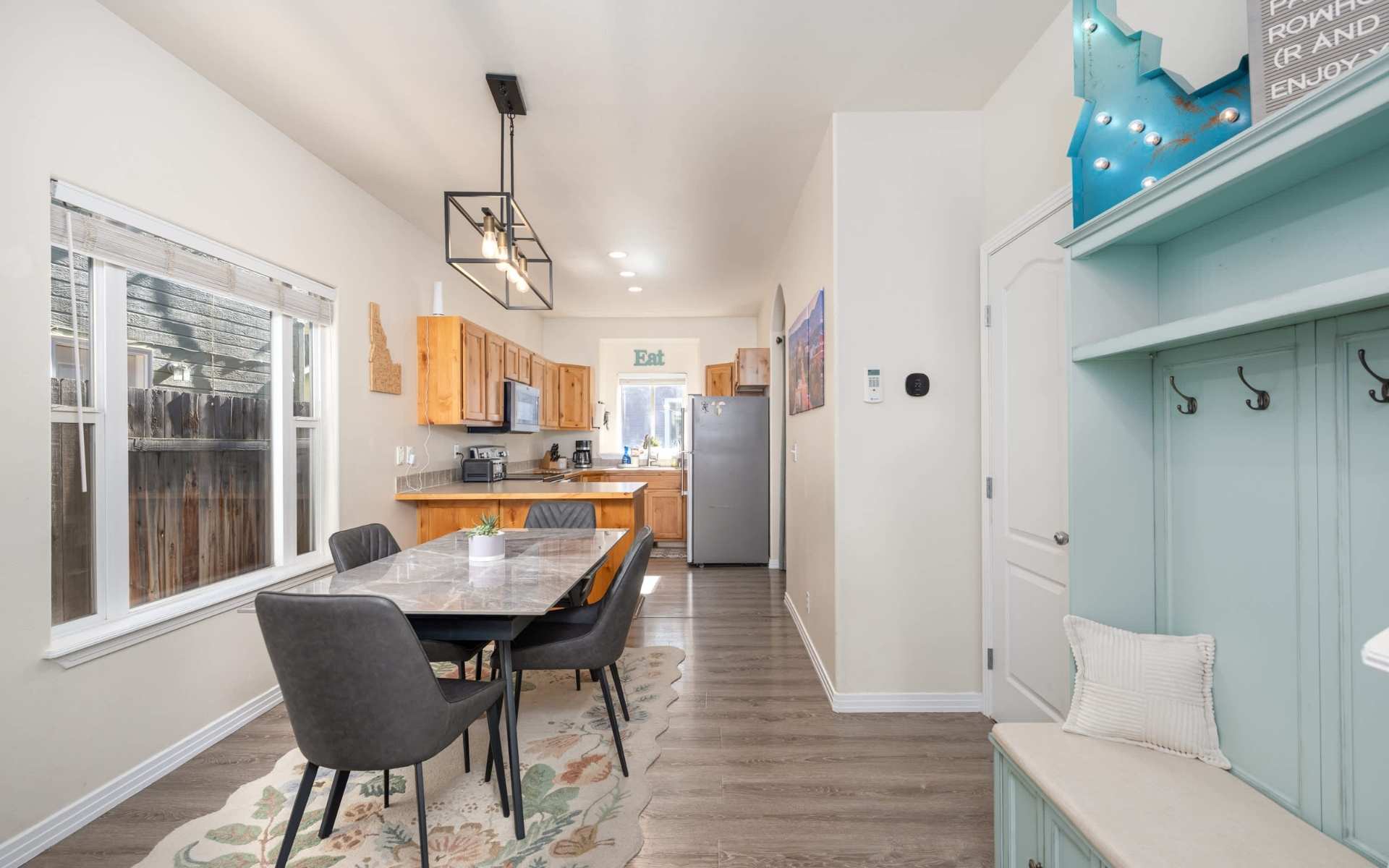 Bright open-concept living and dining room inside a modern Boise vacation rental property.