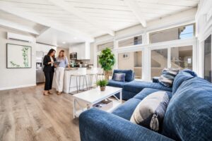 Female homeowner and property manager reviewing rental information inside a San Diego vacation rental.